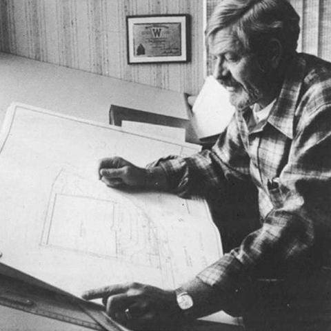 Dee Livingood examining a blueprint.